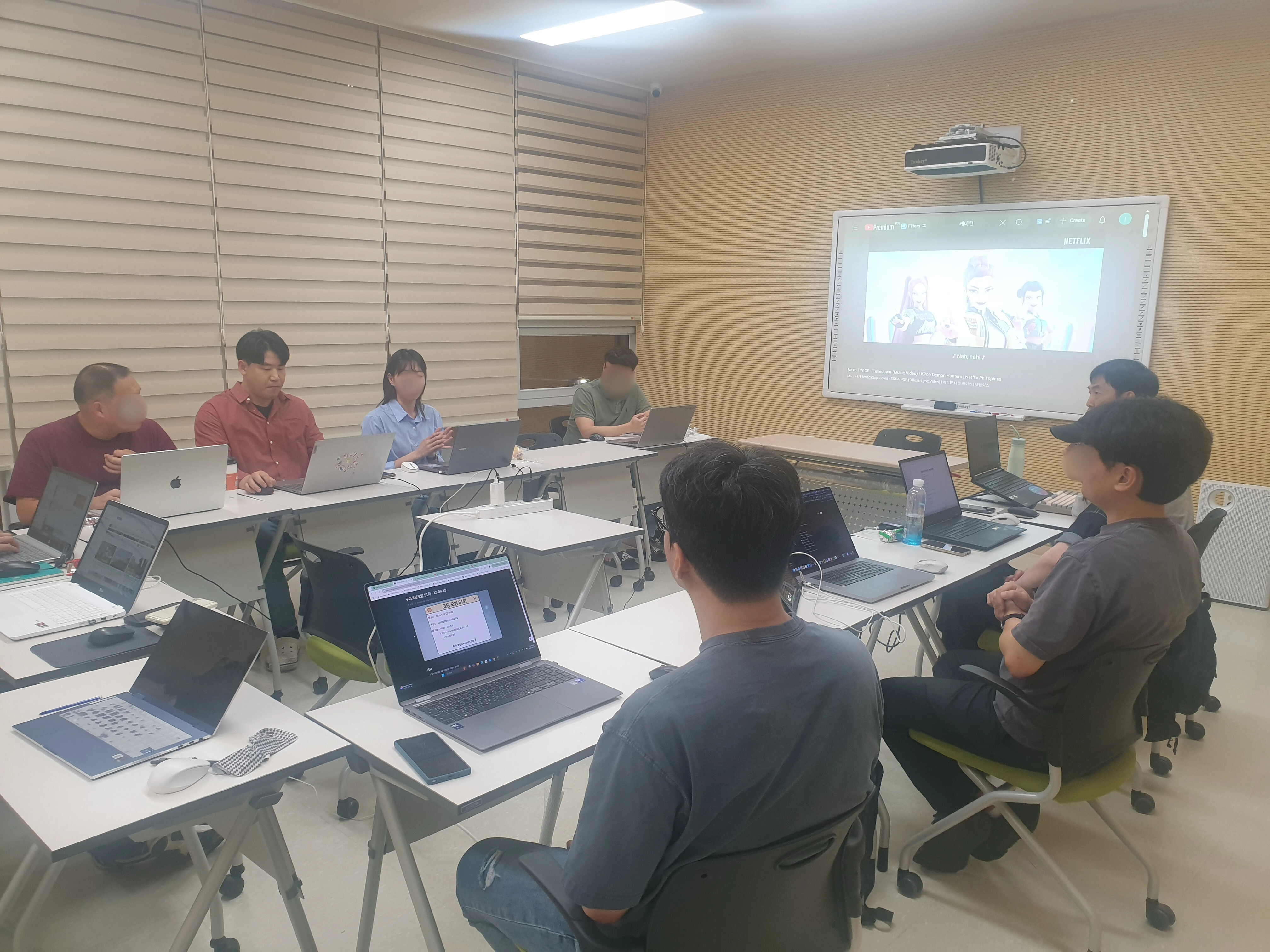 NeonLabs workshop session with laptops and a shared screen